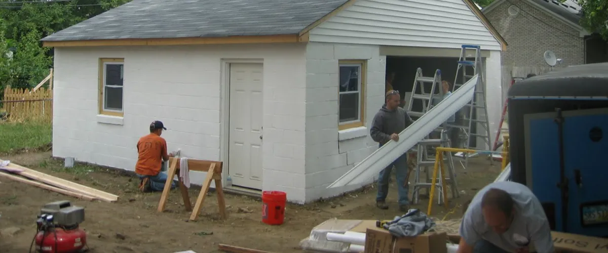 Volunteers rehabbing a garage