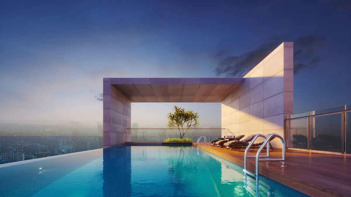 a modern house with a pool and lounge chairs