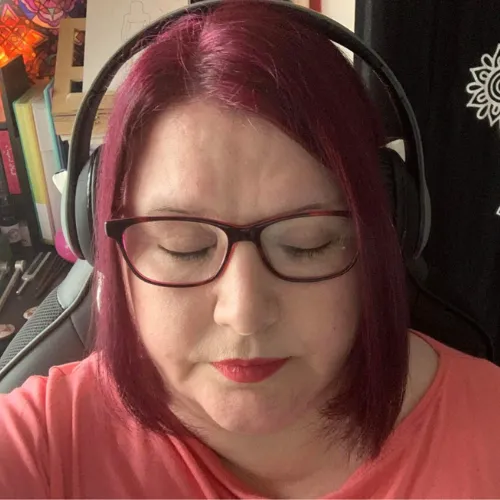 female client meditating wearing headphones