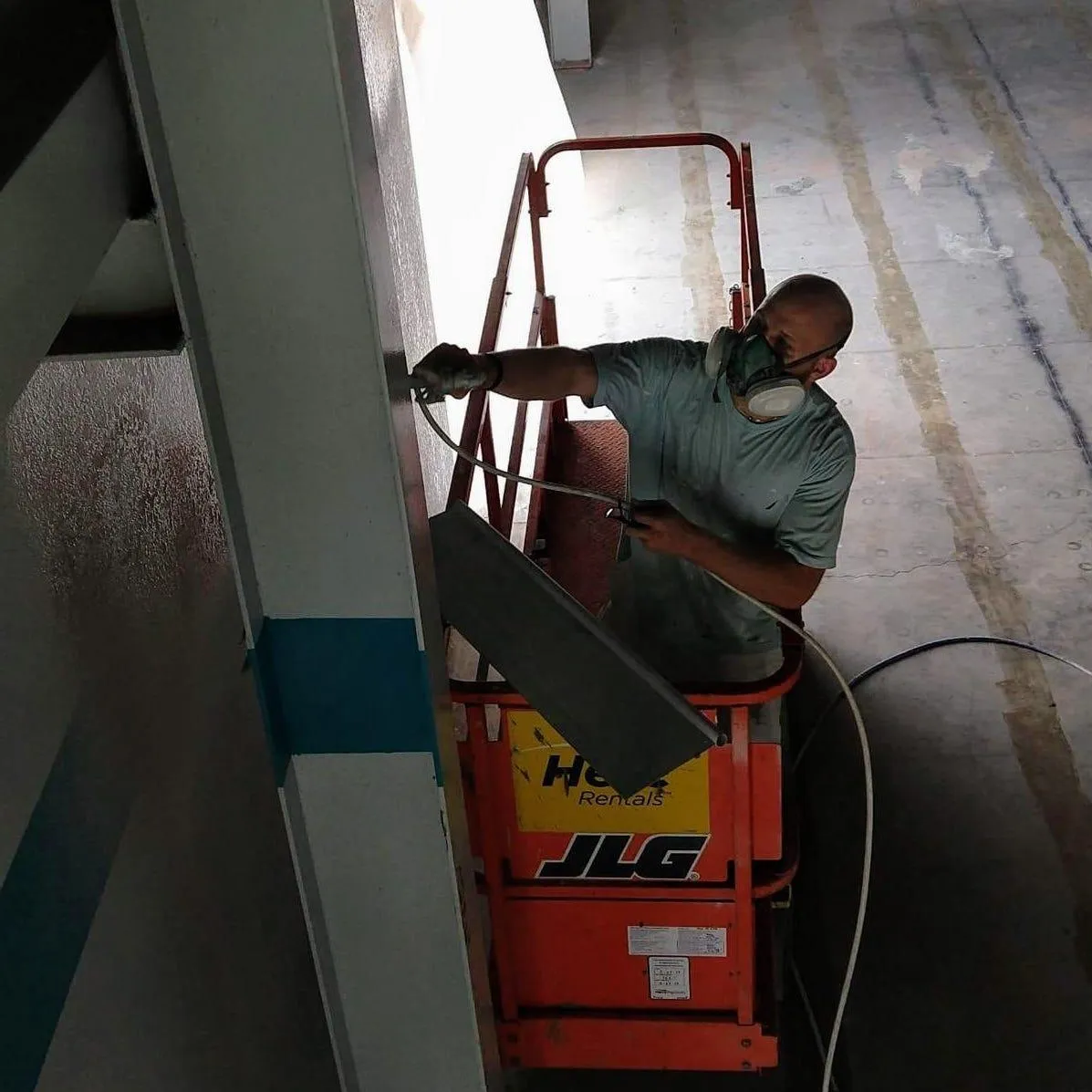 man painting interior wall