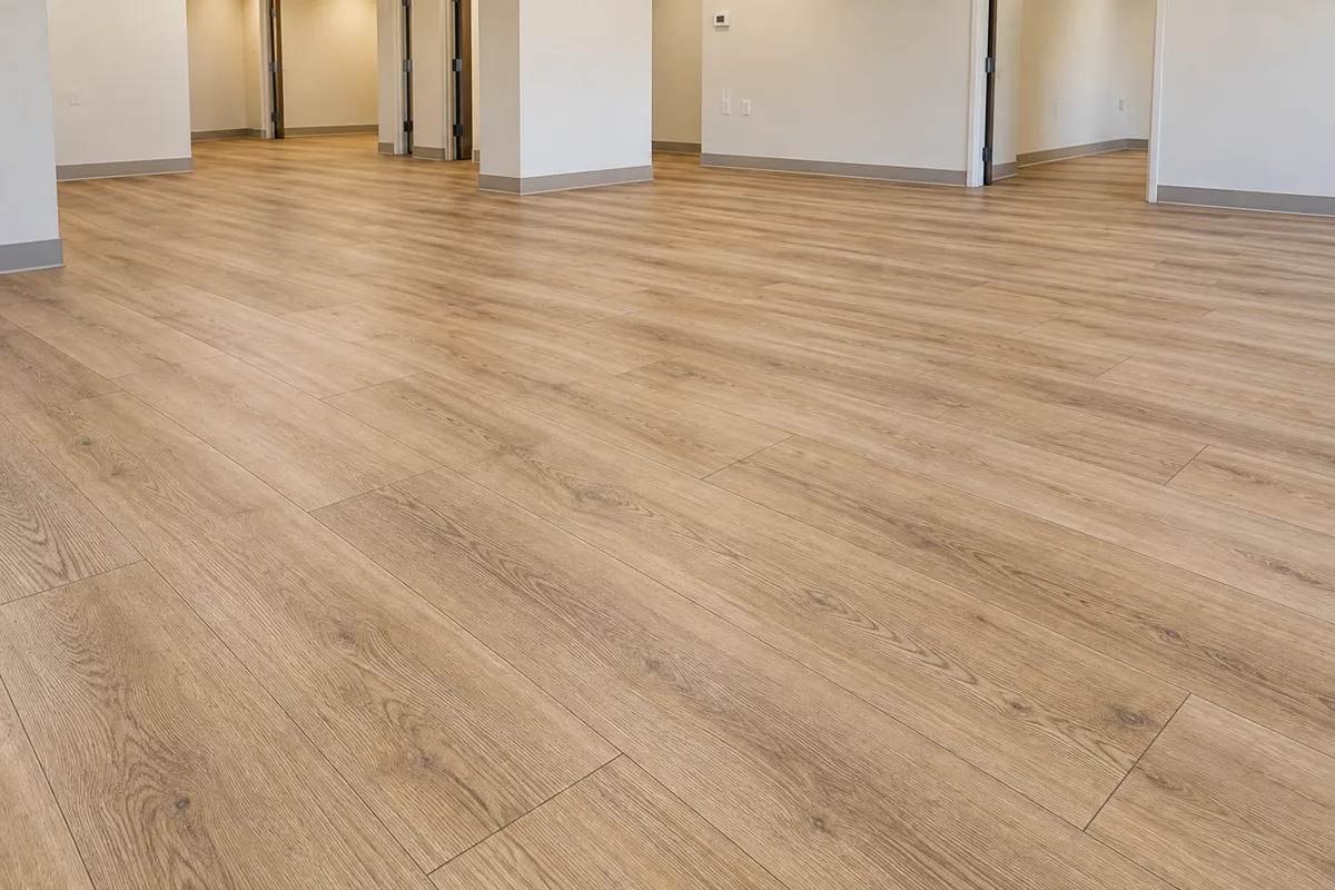 Light oak-look luxury vinyl plank flooring in a spacious commercial interior
