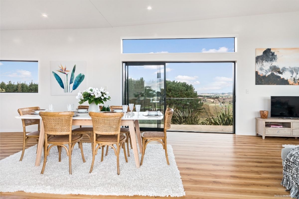 open plan small home dining and living area with indoor outdoor flow NZ