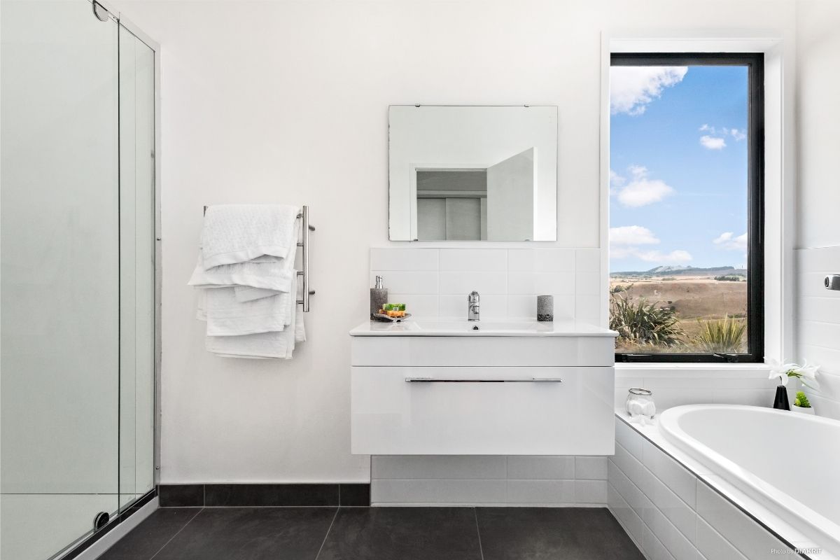 modern small bathroom design with shower and bath compact home NZ