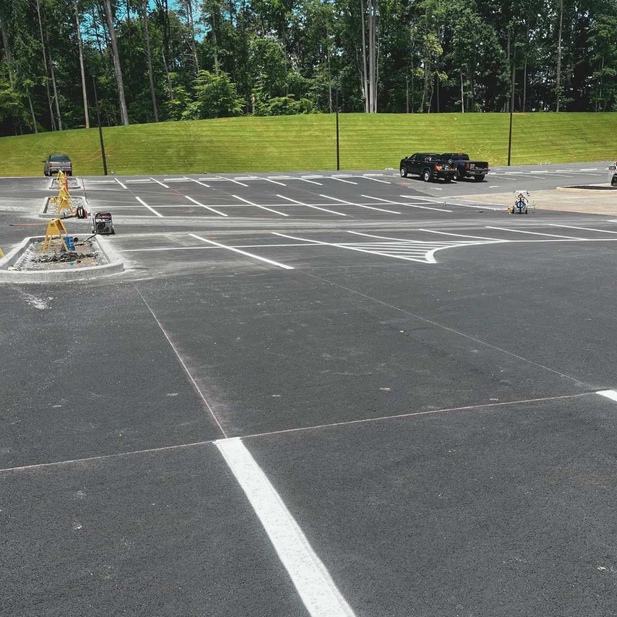 Newly installed blacktop parking area with ADA-compliant markings – Dawsonville, GA”