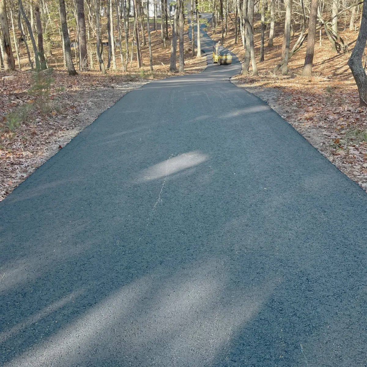 New asphalt driveway installed by Askew & Sons in Cumming, GA – smooth finish and clean edge work