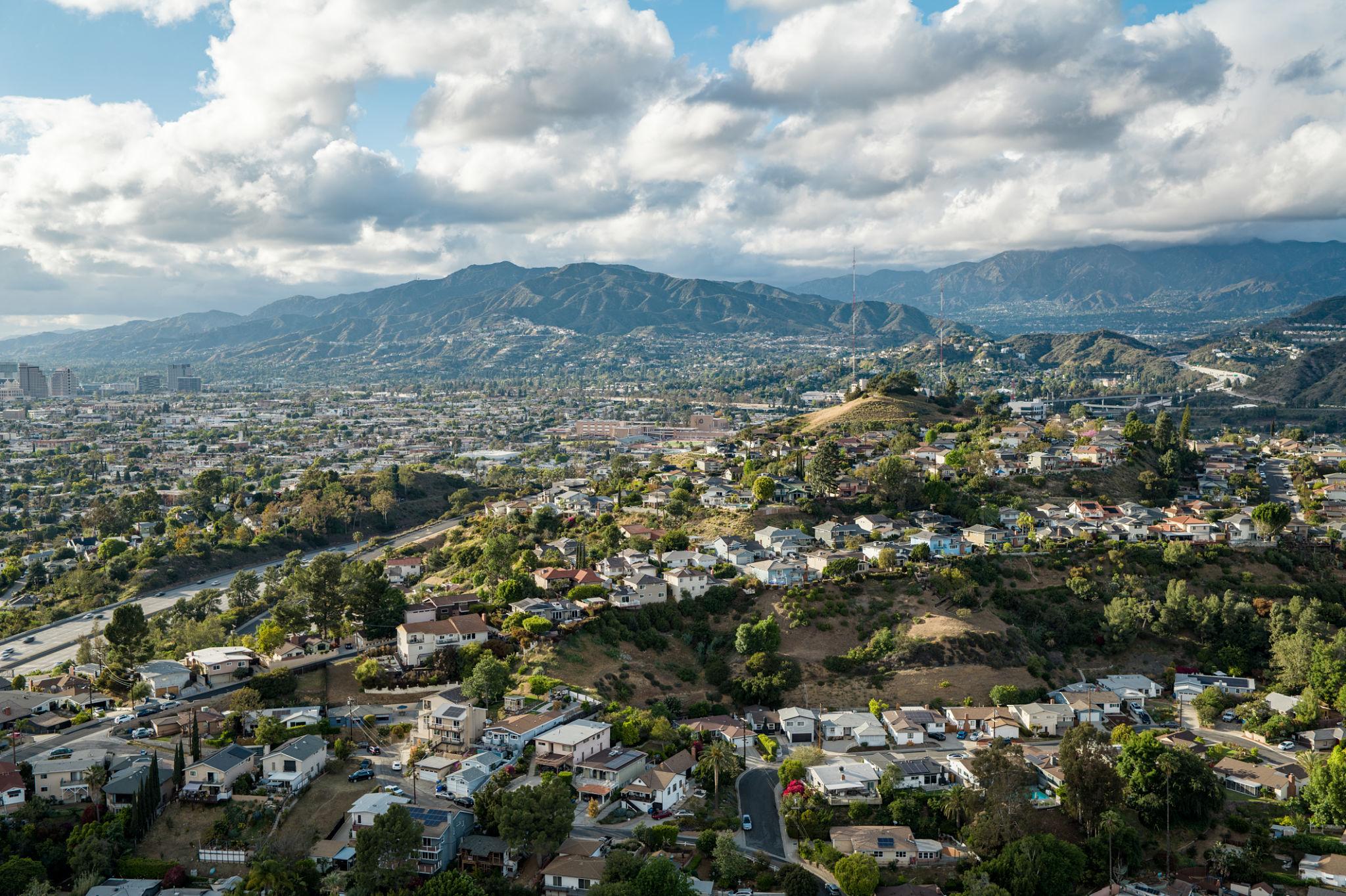 Scenic view of Conejo Valley neighborhoods surrounded by rolling hills and open space.
