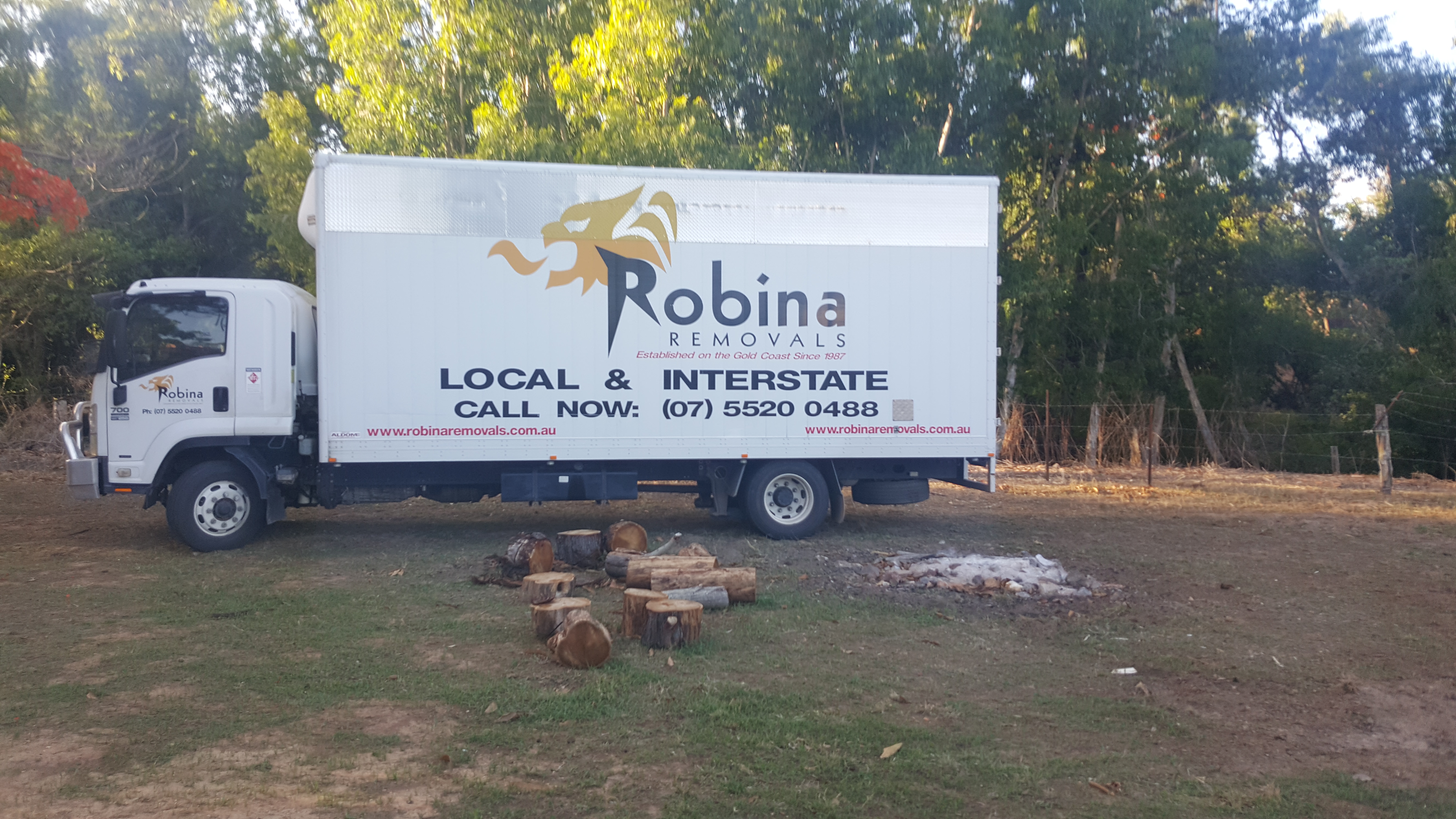 Various red tools hanging on a window frame.