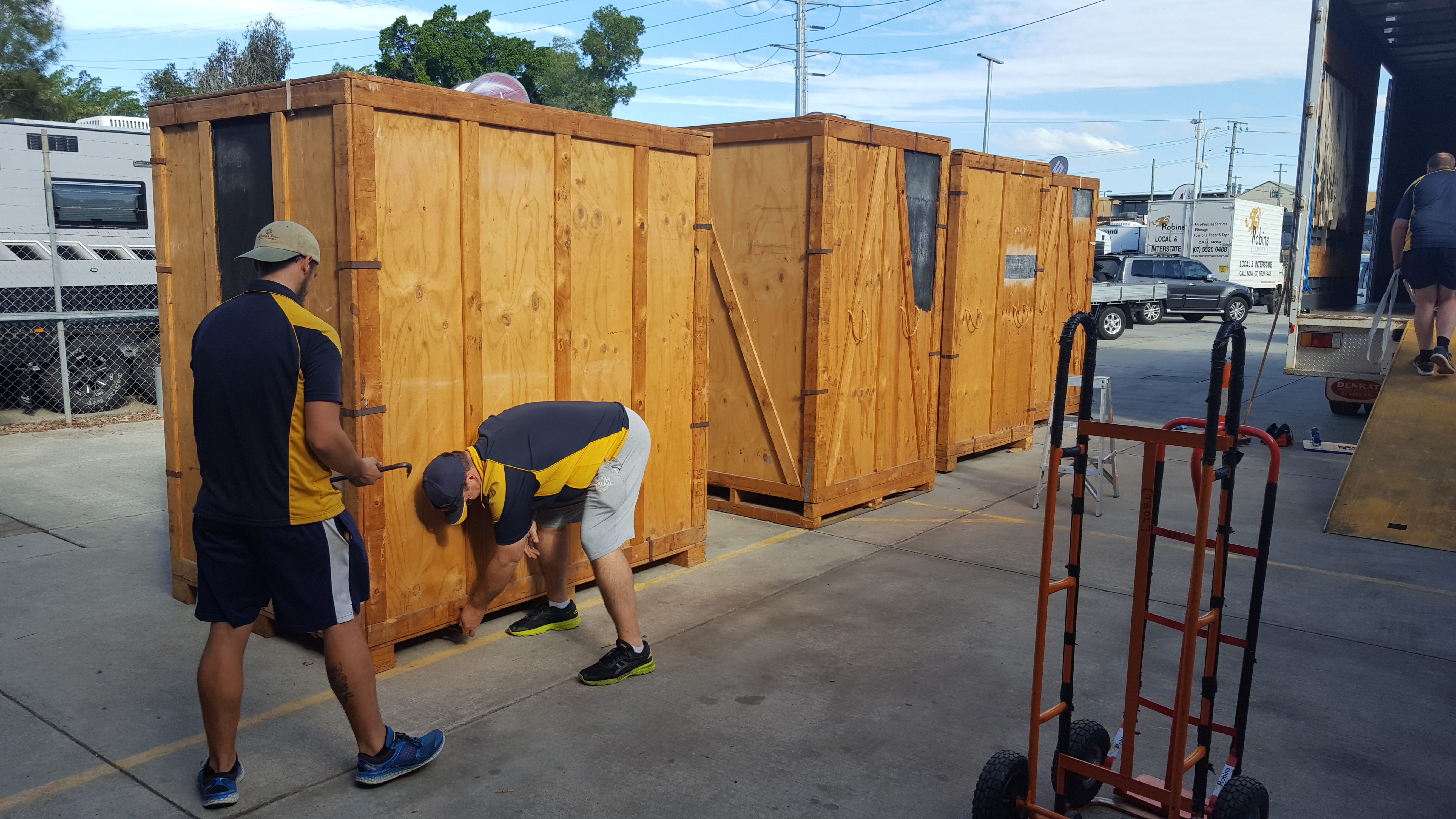 Rows of grey metal lockers with a yellow padlock.