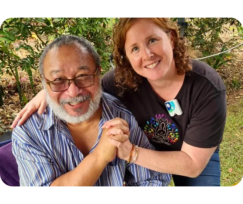 person holding pencil near laptop computer