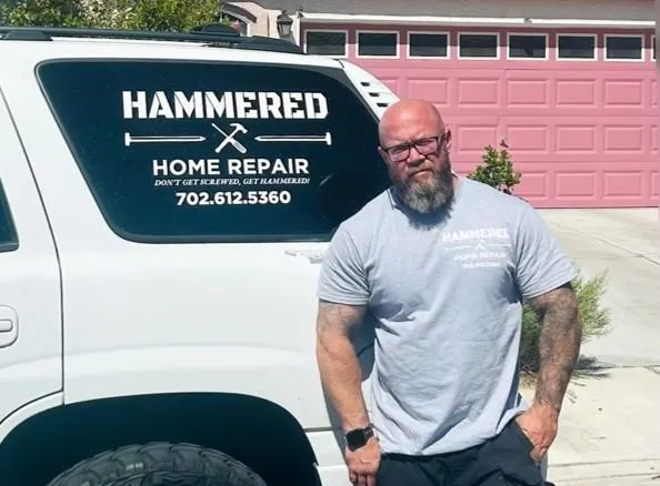 handyman sitting on a car