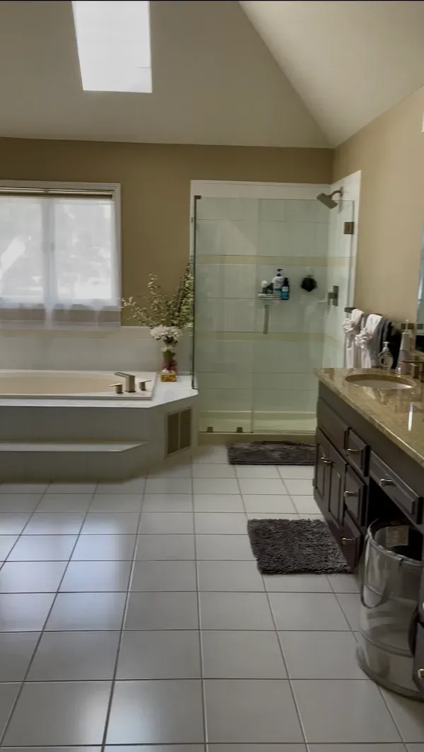 tandard bathroom cleaning with disinfected sink, mirror, and freshly mopped floor.