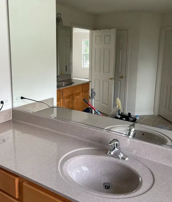 Bathroom after post-construction cleaning with spotless tiles, polished fixtures, and a dust-free finish.