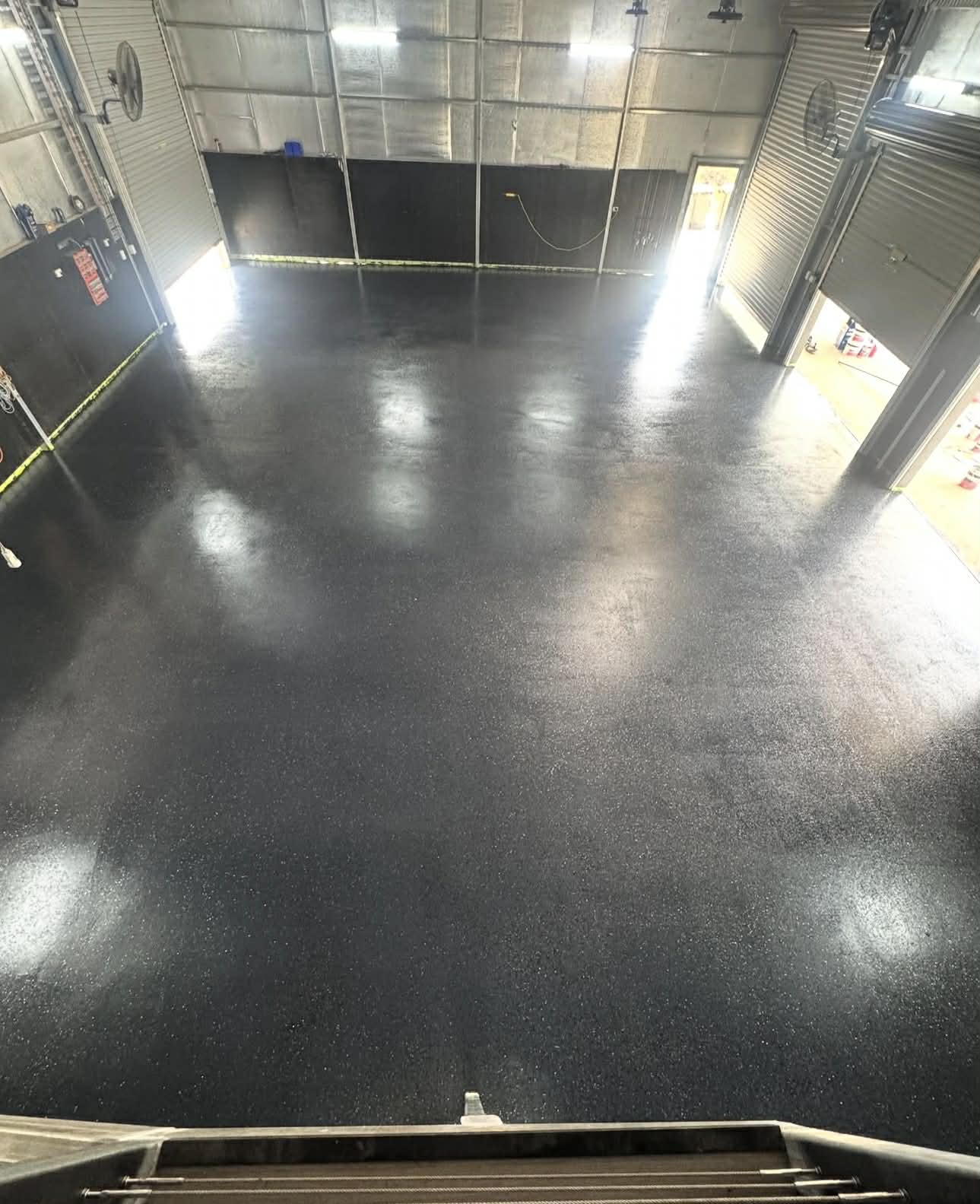 black epoxy flake floor in a commercial warehouse