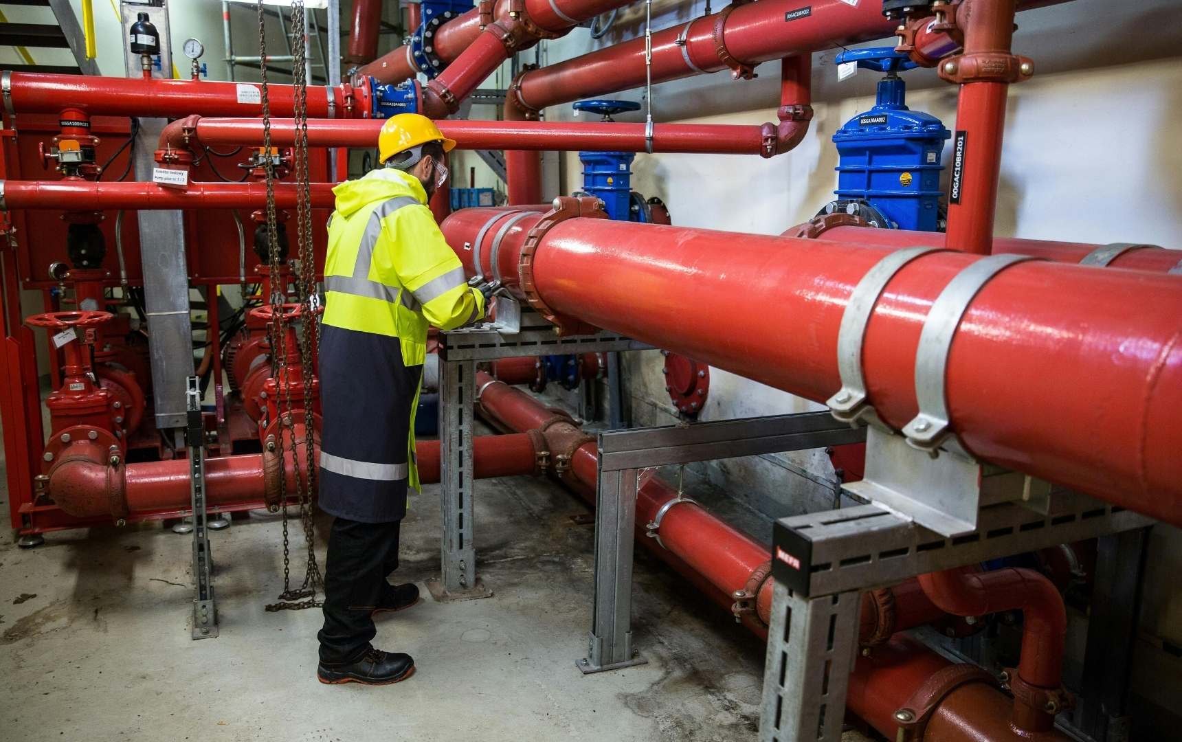 Technician performing water hammer inspections