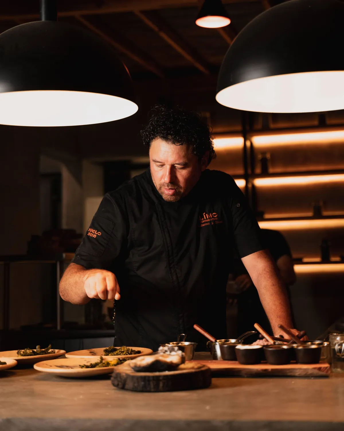Chef Guillermo J. Gómez at the fire