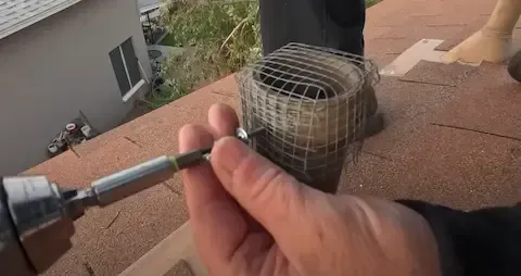 Rodent entry-point exclusion screen installation by Beloit Pest Control.