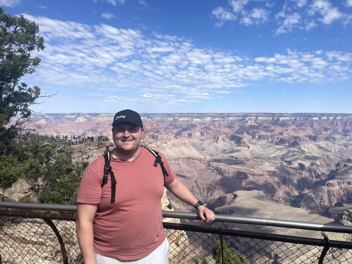 man standing in front of group of men