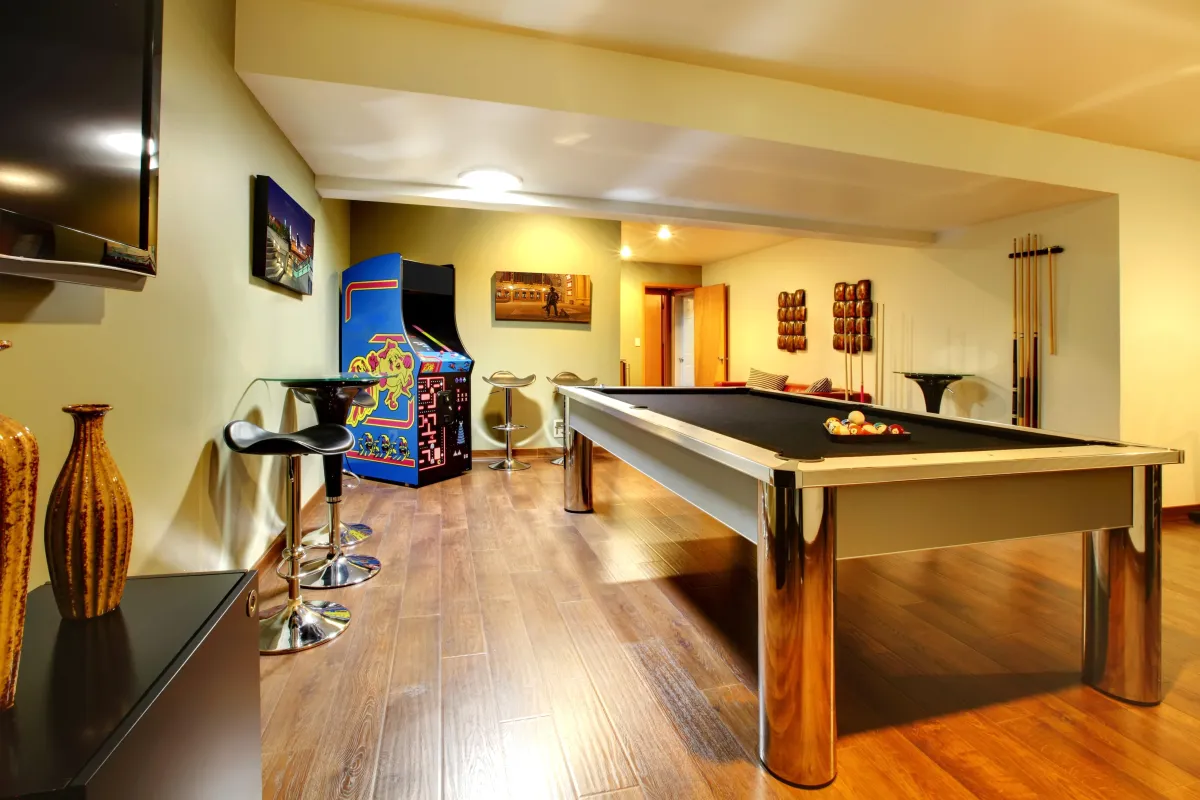 basement finishing done, pool table and wooden flooring