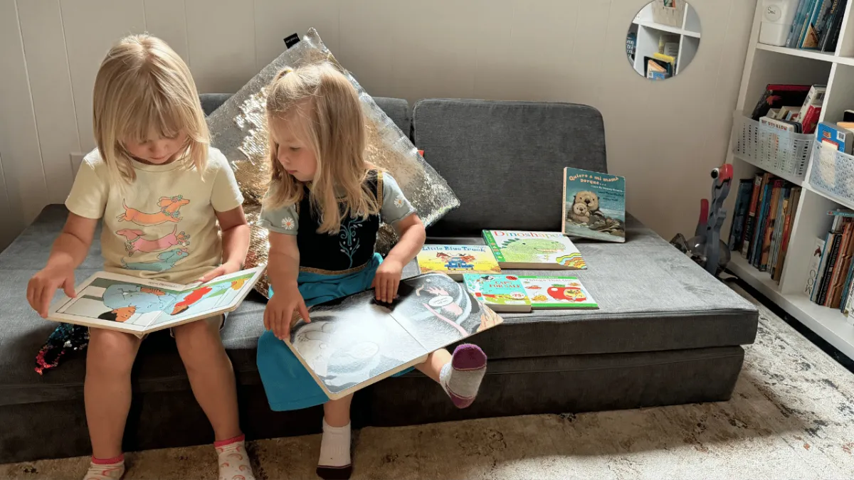 children reading books in home childcare