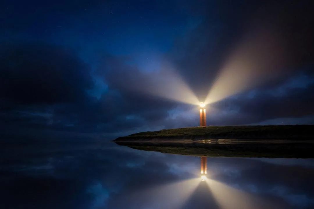 lighthouse with beaming light