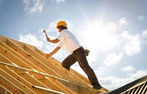 picture of a roofer on a roof
