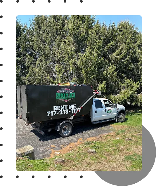 Dirty D's Junk Removal branded dumpster rental truck with rent me signage and phone number