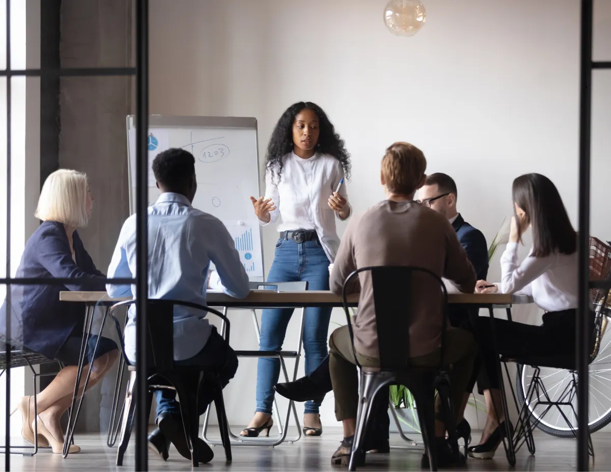Business owner using documented systems and virtual assistants to streamline operations and scale a growing company.