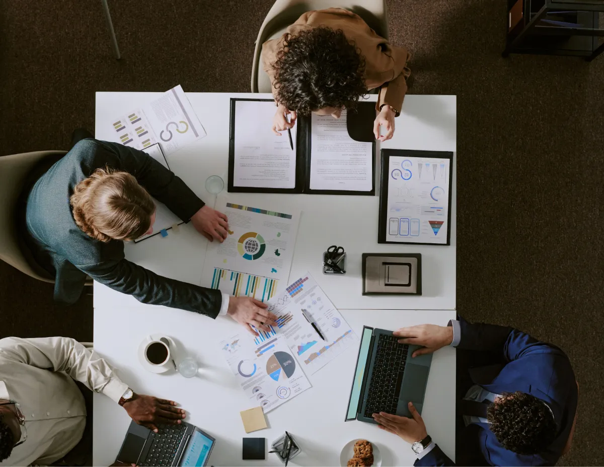 Entrepreneur delegating routine business tasks to a virtual assistant and team members to focus on strategy, leadership, and growth.