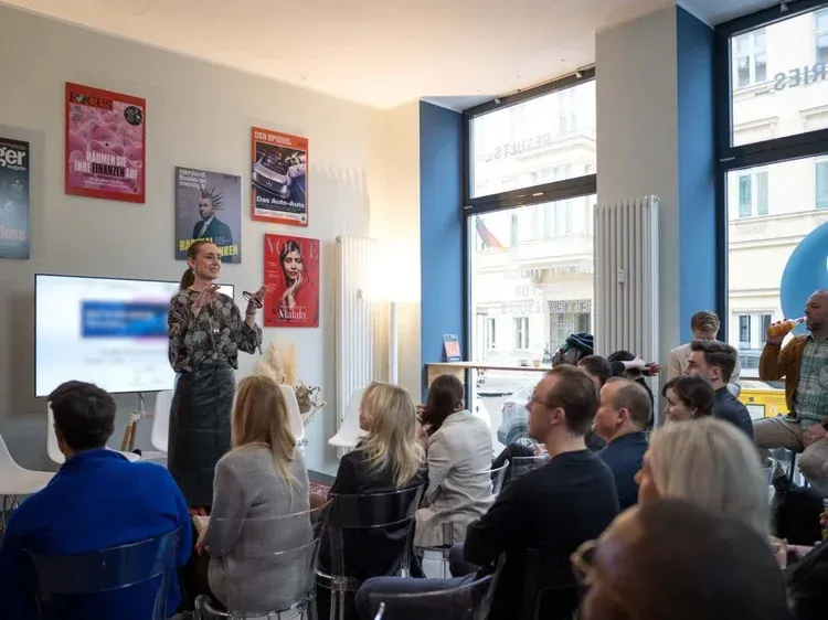 	Jeanette Okwu presenting an AI workshop to a seated audience