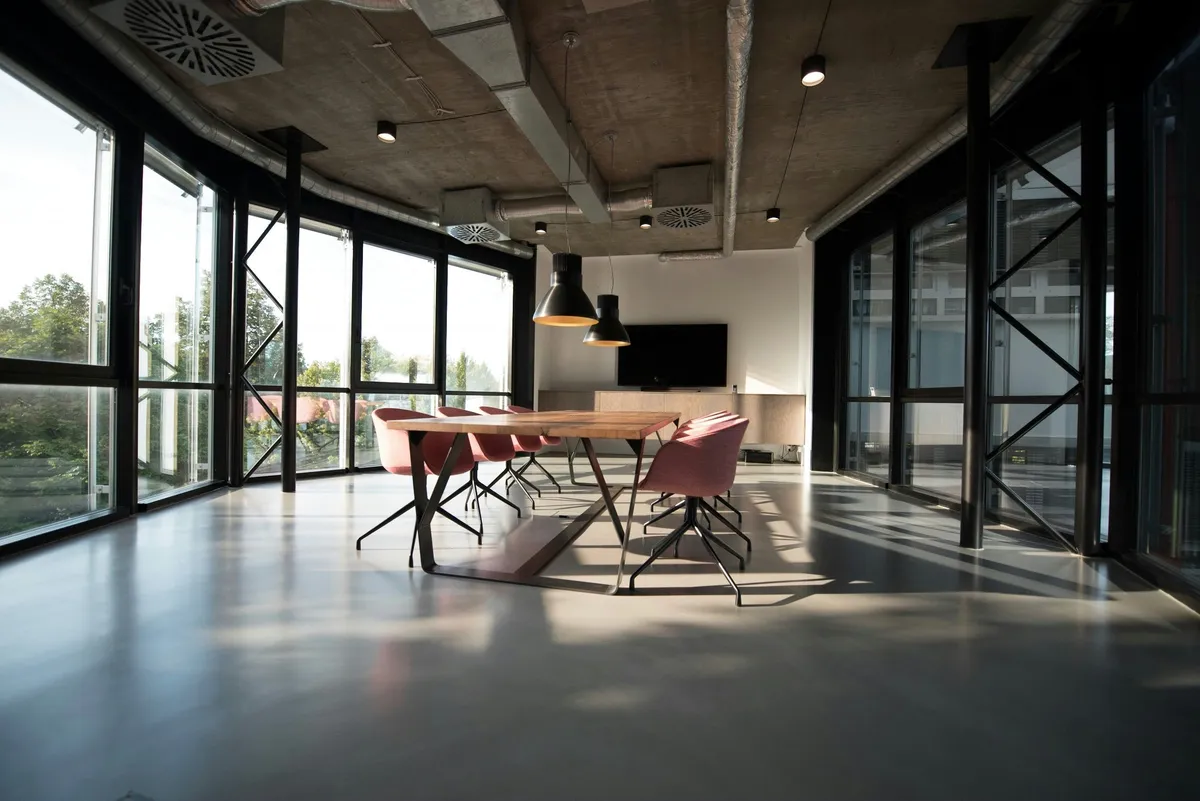 Small commercial office space cleaned by Total Clean SolutionProfessional cleaner organizing a closet