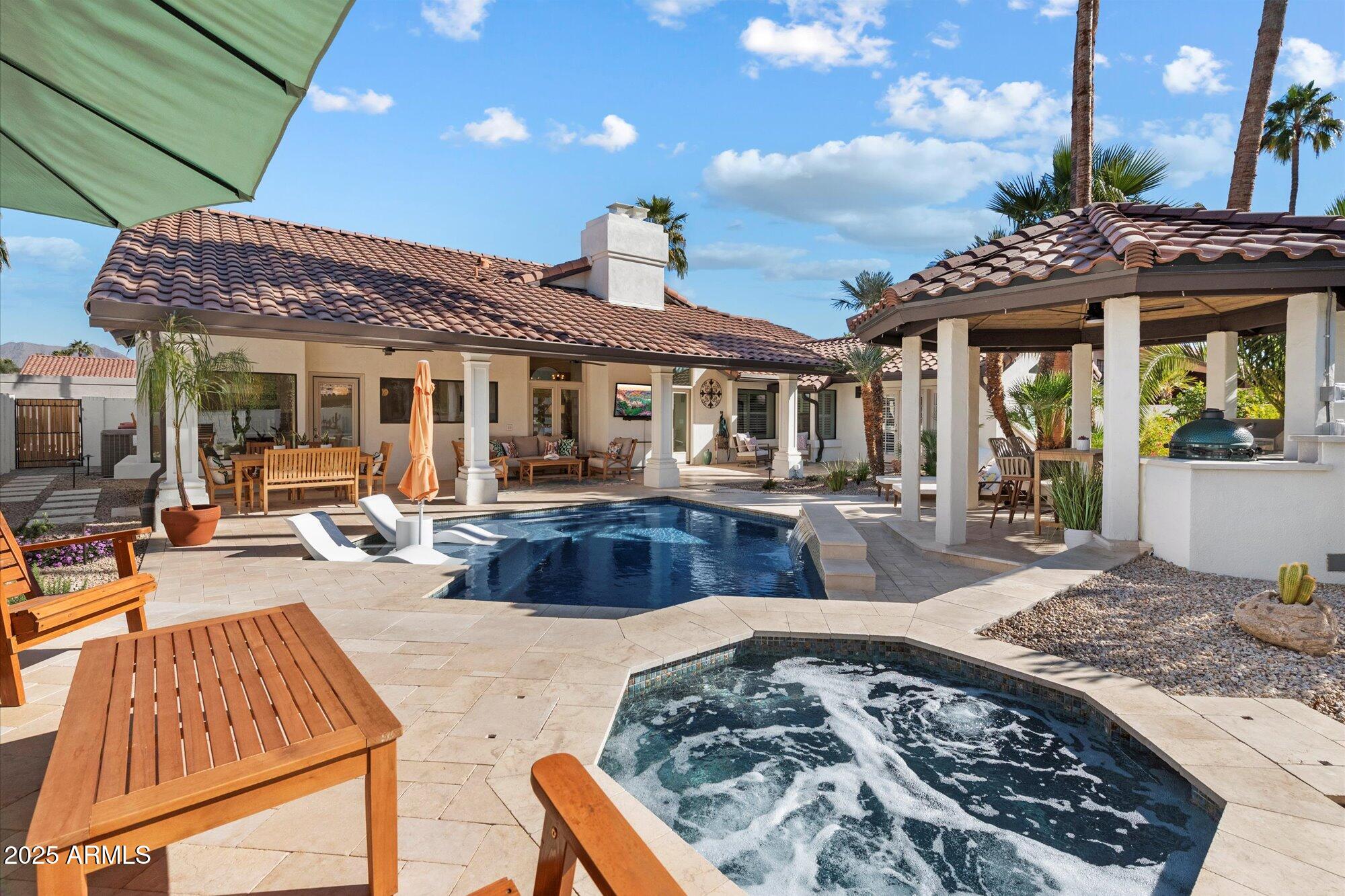 Brick house with a field and trees