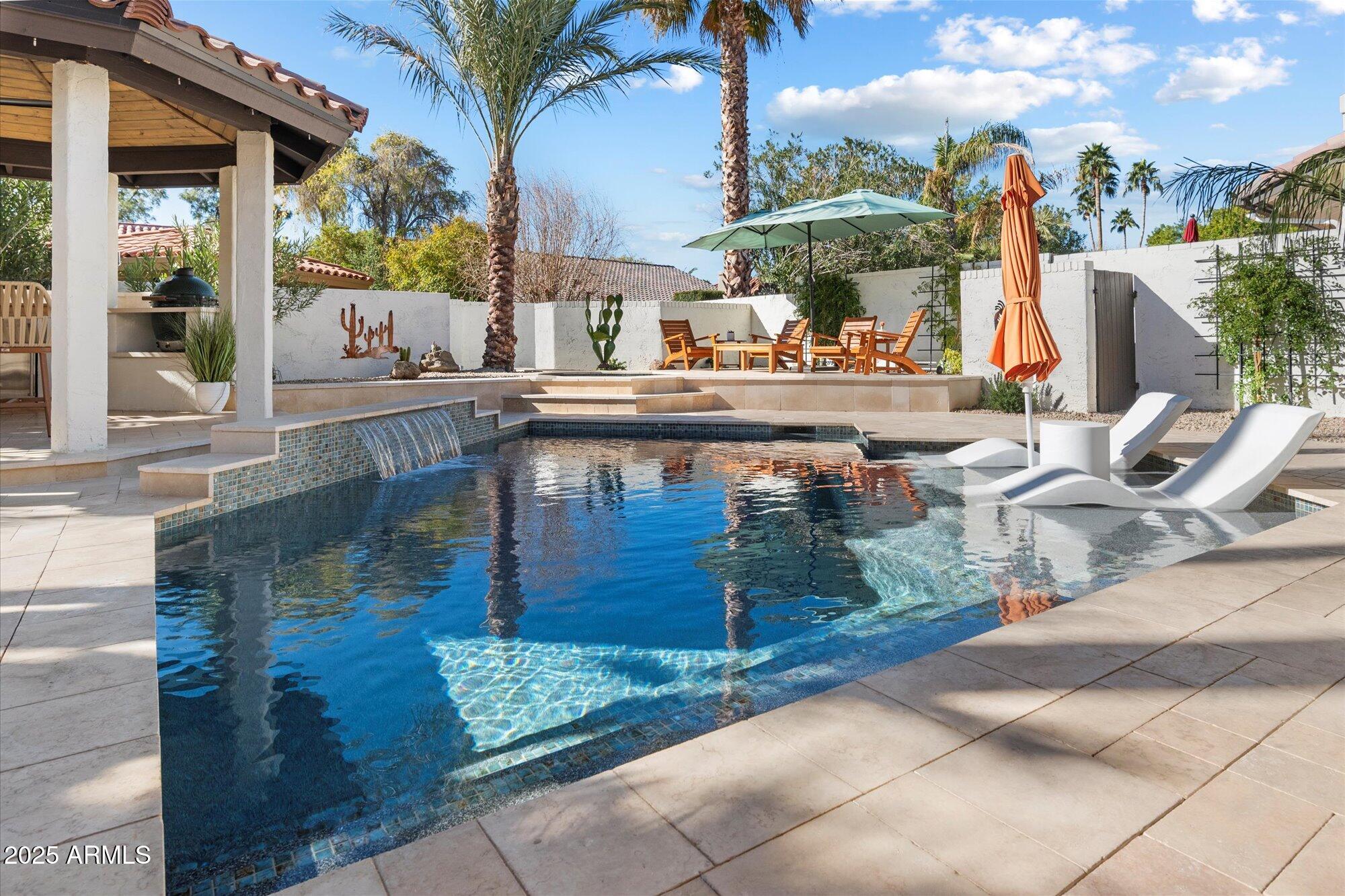 Brick house with a field and trees