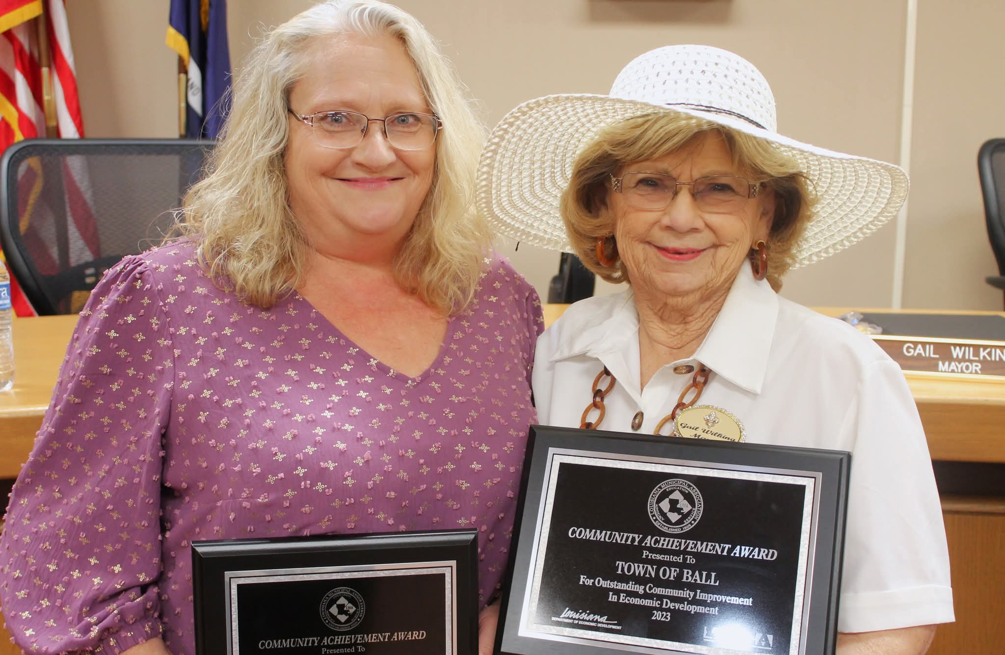 people sitting on floor front of table