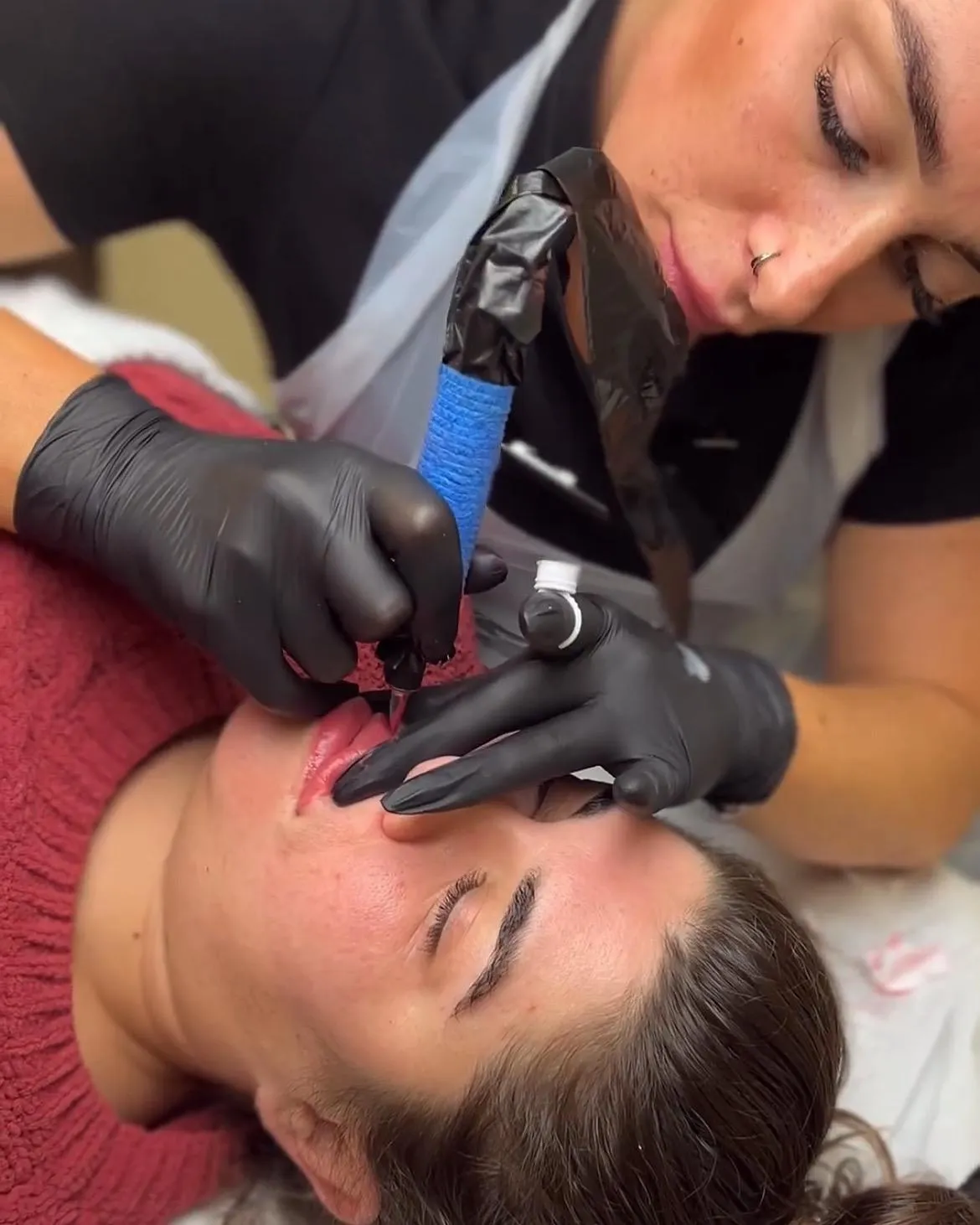 PMU Artist and fine line tattoo artist, Kelly, performng permanent makeup on a girl in St Albans.