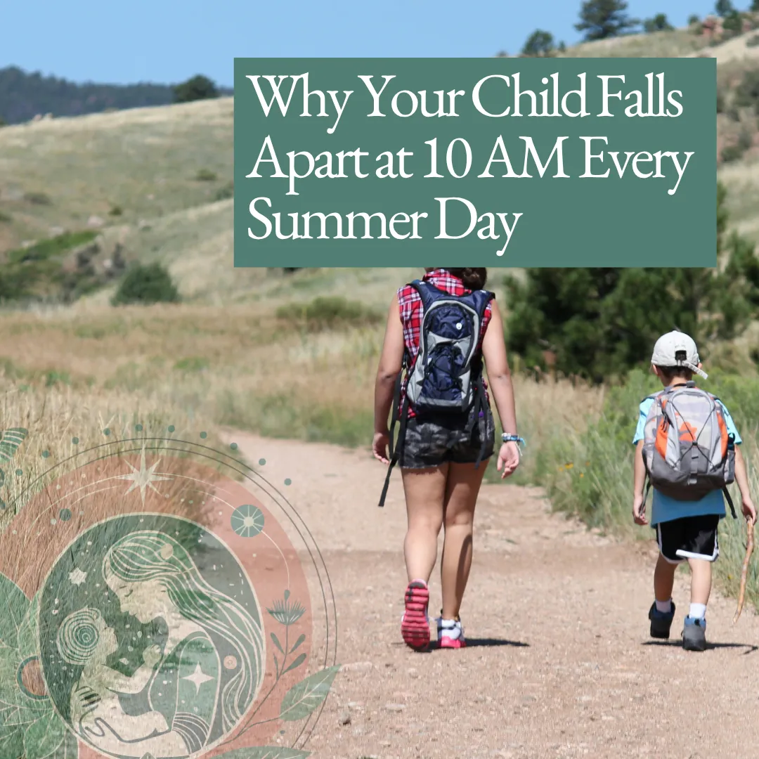 A mother and young son walking together on a sunlit hiking trail through golden summer grasses, both wearing backpacks.
