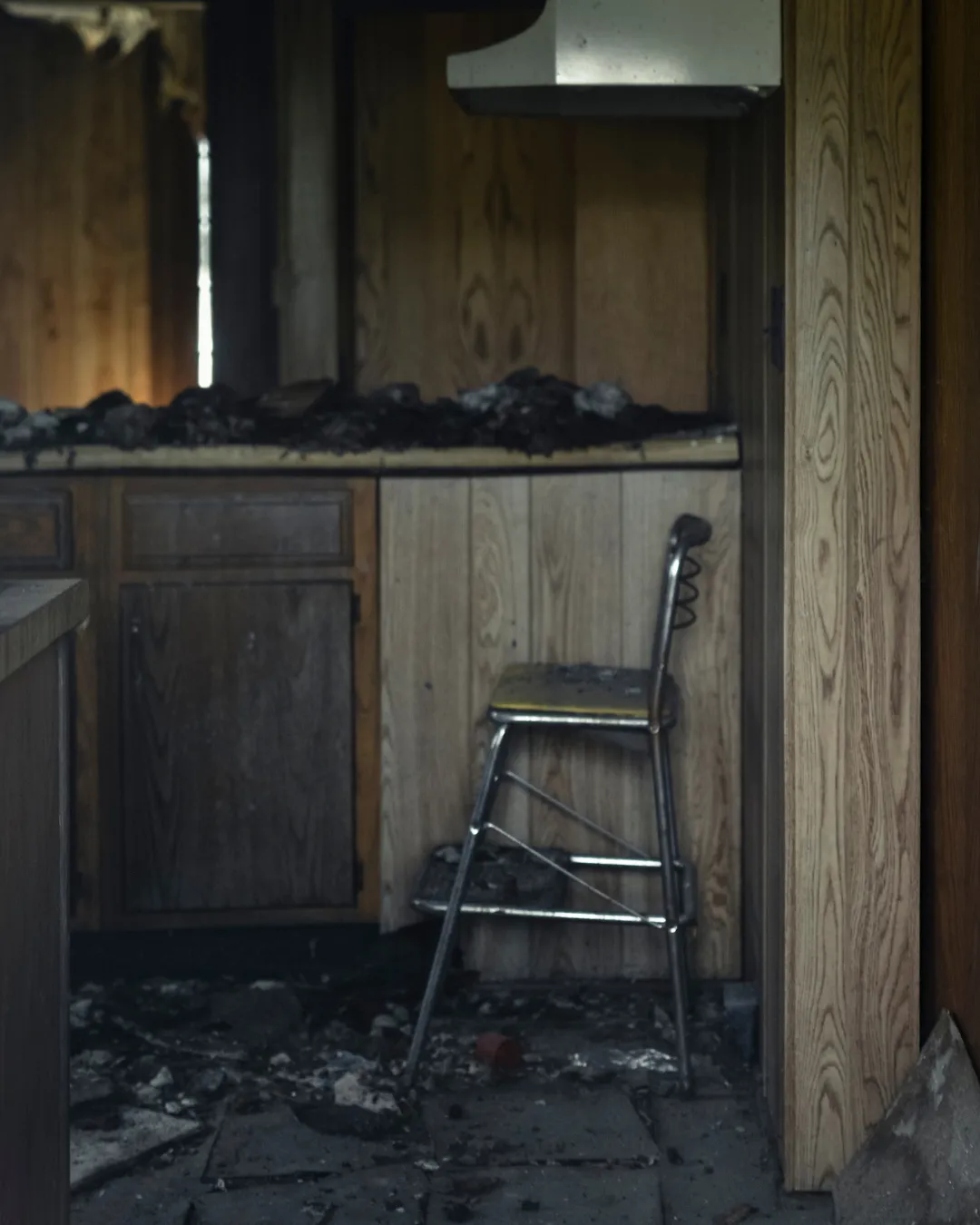 fire damage restoration crew cleaning a smoke damaged room