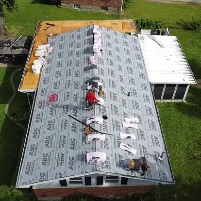 Experienced roofing specialist installing new shingle roof on residential home in Missouri