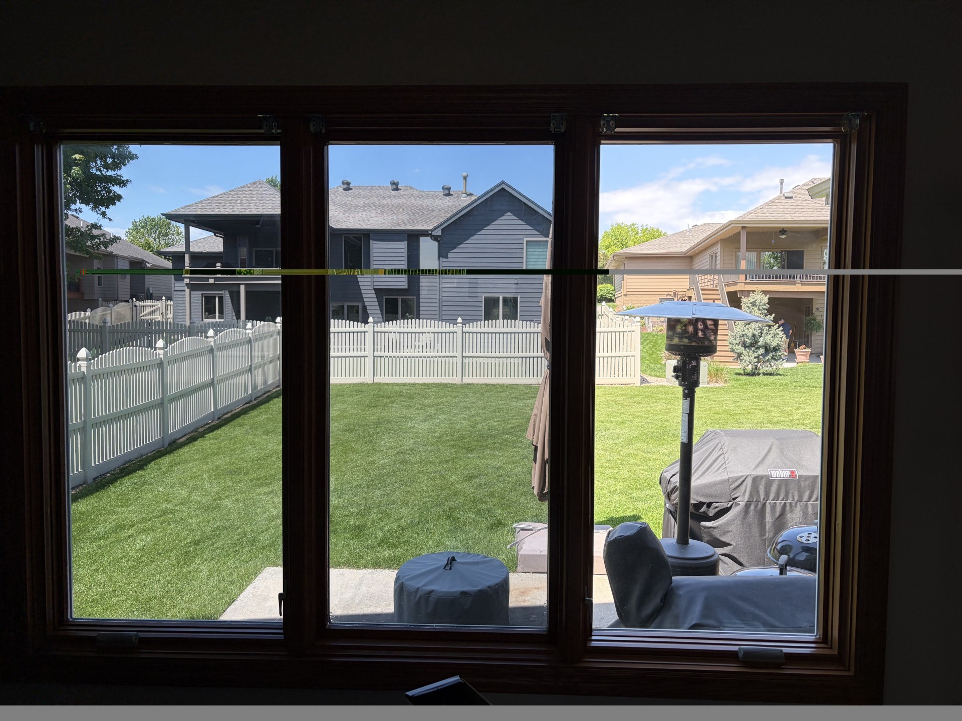 Sun control window tint applied to home windows using scaffold