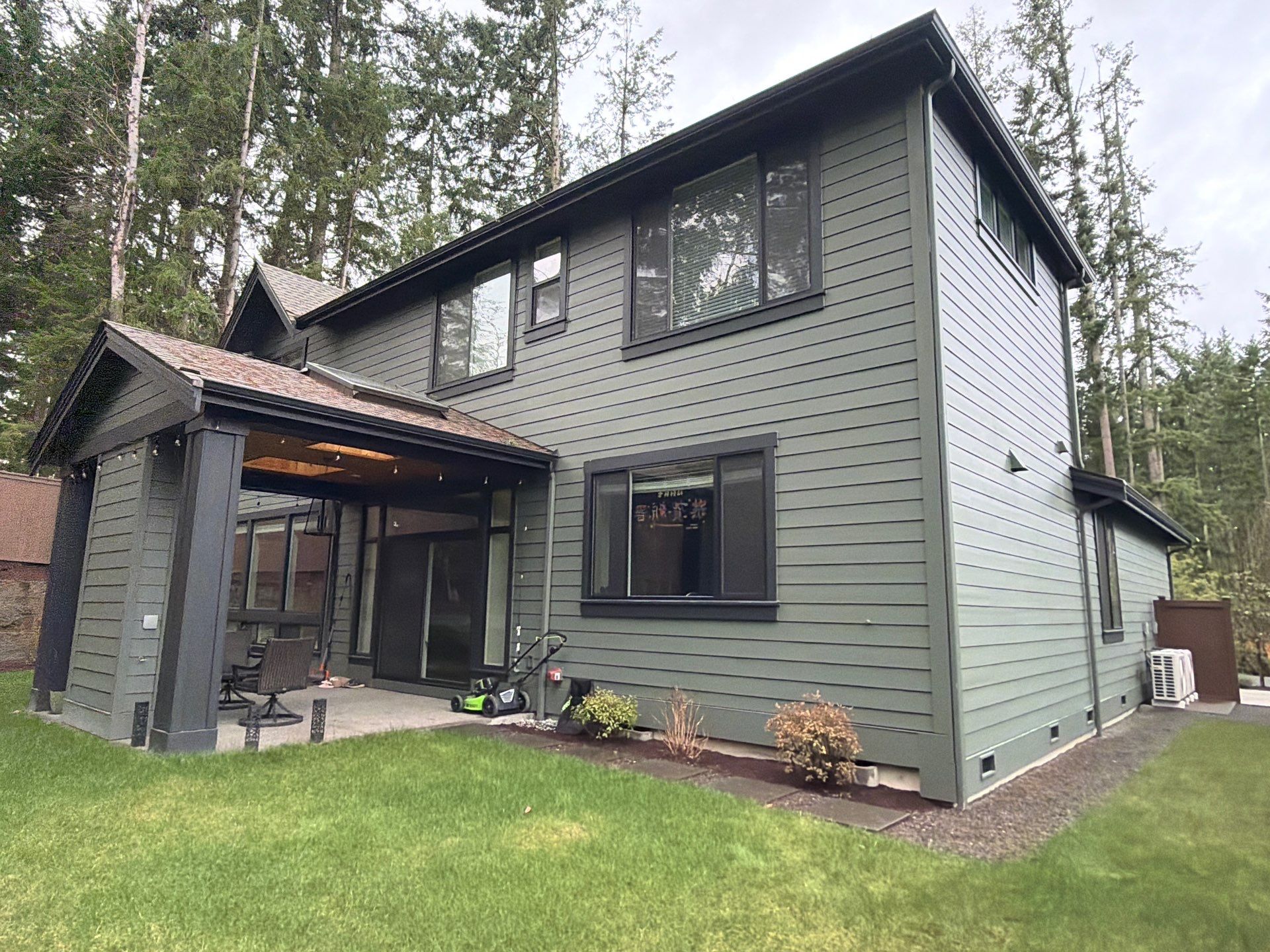 Roofing professionals conducting roof cleaning service