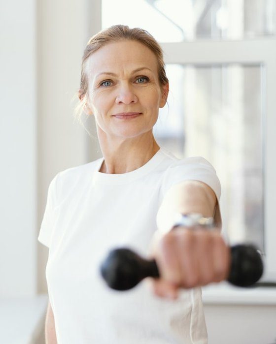 Older woman lifting a dumbbell