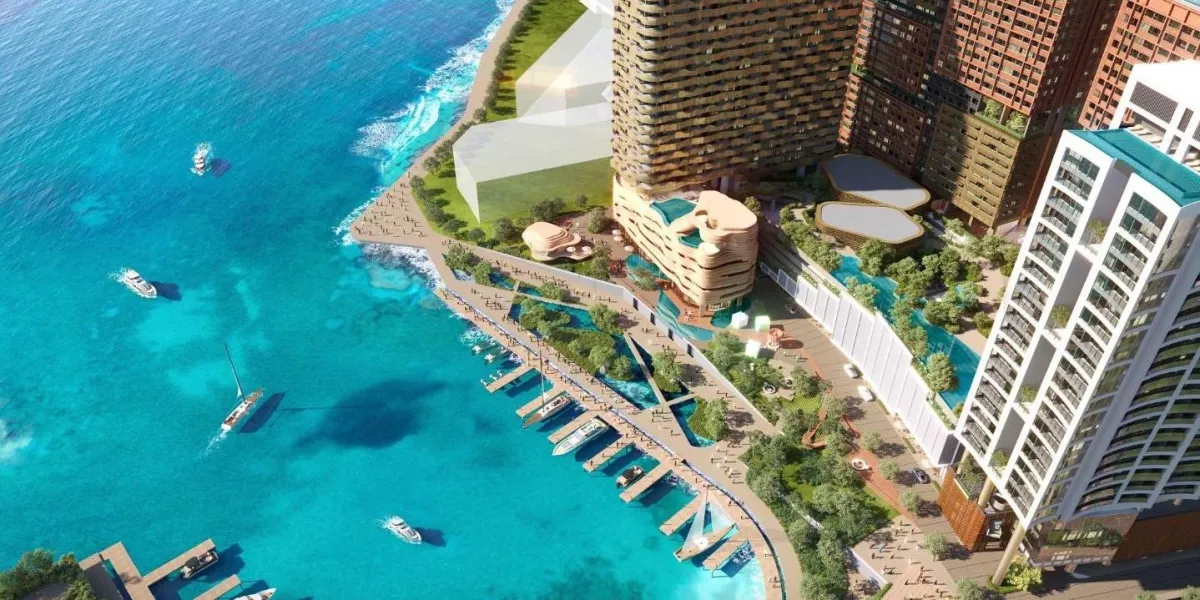 Bird’s eye view of Jesselton Docklands marina with The Bedrock towers and landscaped deck.