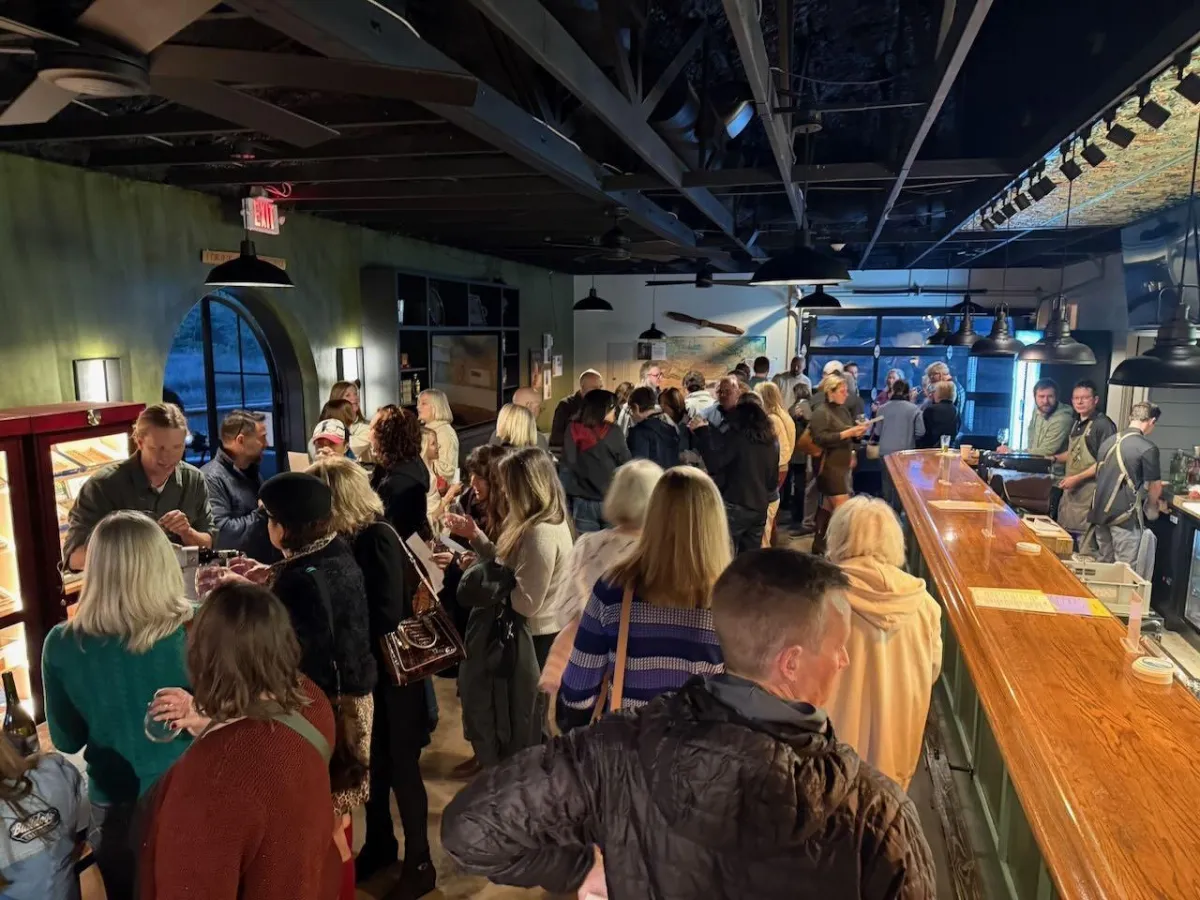 Crowd filling the bar during a private event at Uptown Tap & Cigar