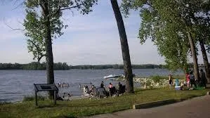 Lakeside view of Lake Macbride with trees and boats docked near shore