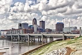 City skyline of downtown Des Moines with modern buildings and bridge