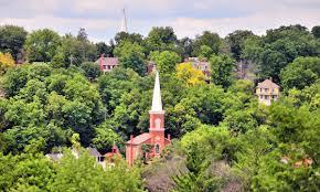 Elevated view of Dubuque’s Eagle Point area with tree cover and historic buildings