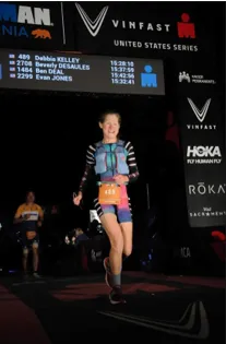 Debbie Kelley running toward the finish line at Ironman California