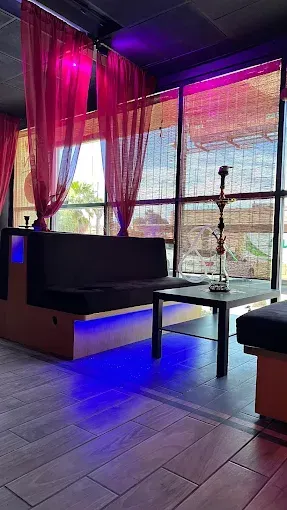 DJ night at Sky Cafe & Lounge with neon lights.