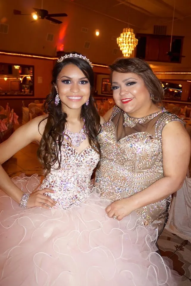 Leyla Silva and her mom smiling during her quinceañera celebration