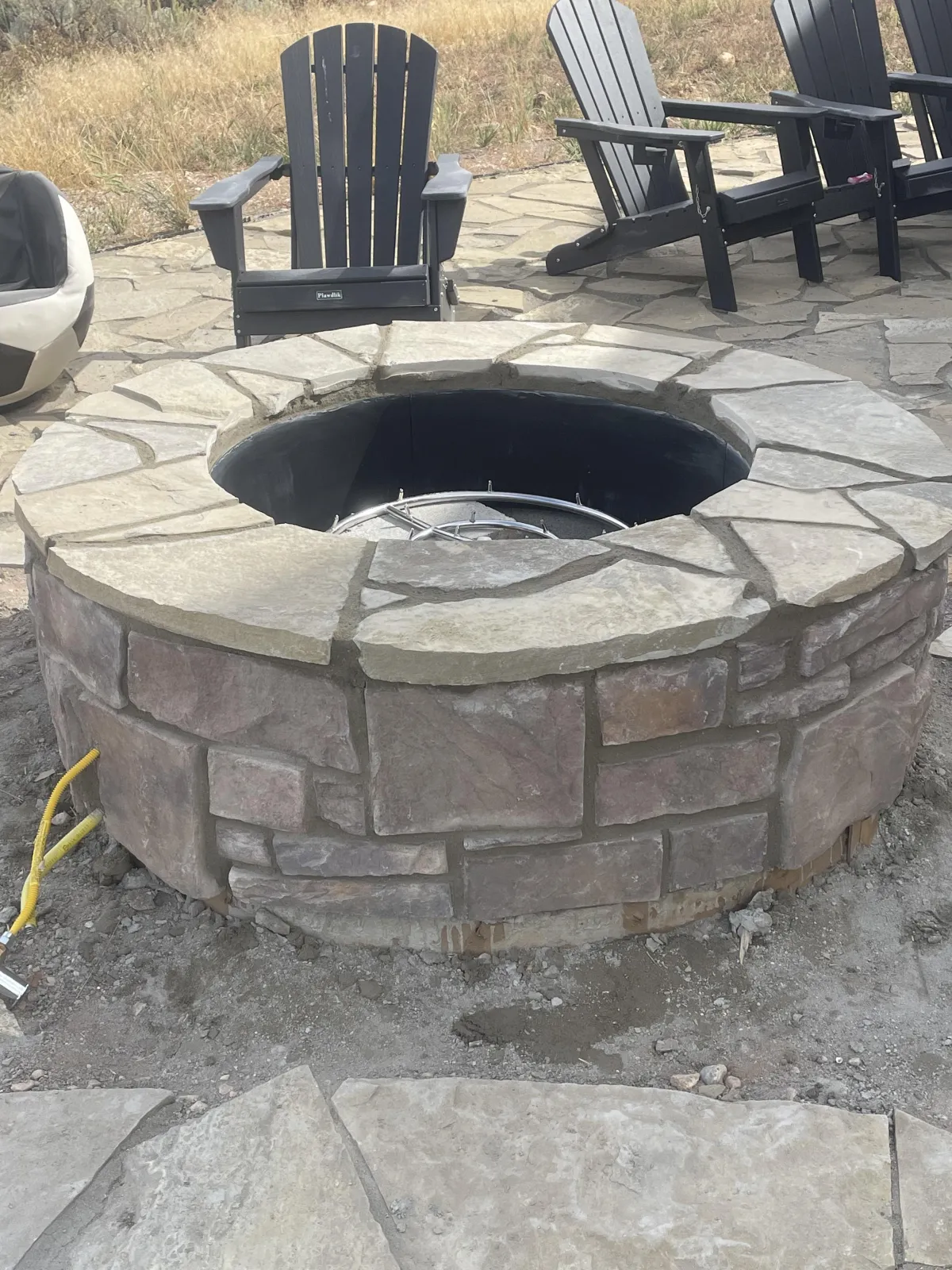 Masonry contractor from AMG Construction & Landscaping installing brick veneer on a commercial building in Kearns, Utah
