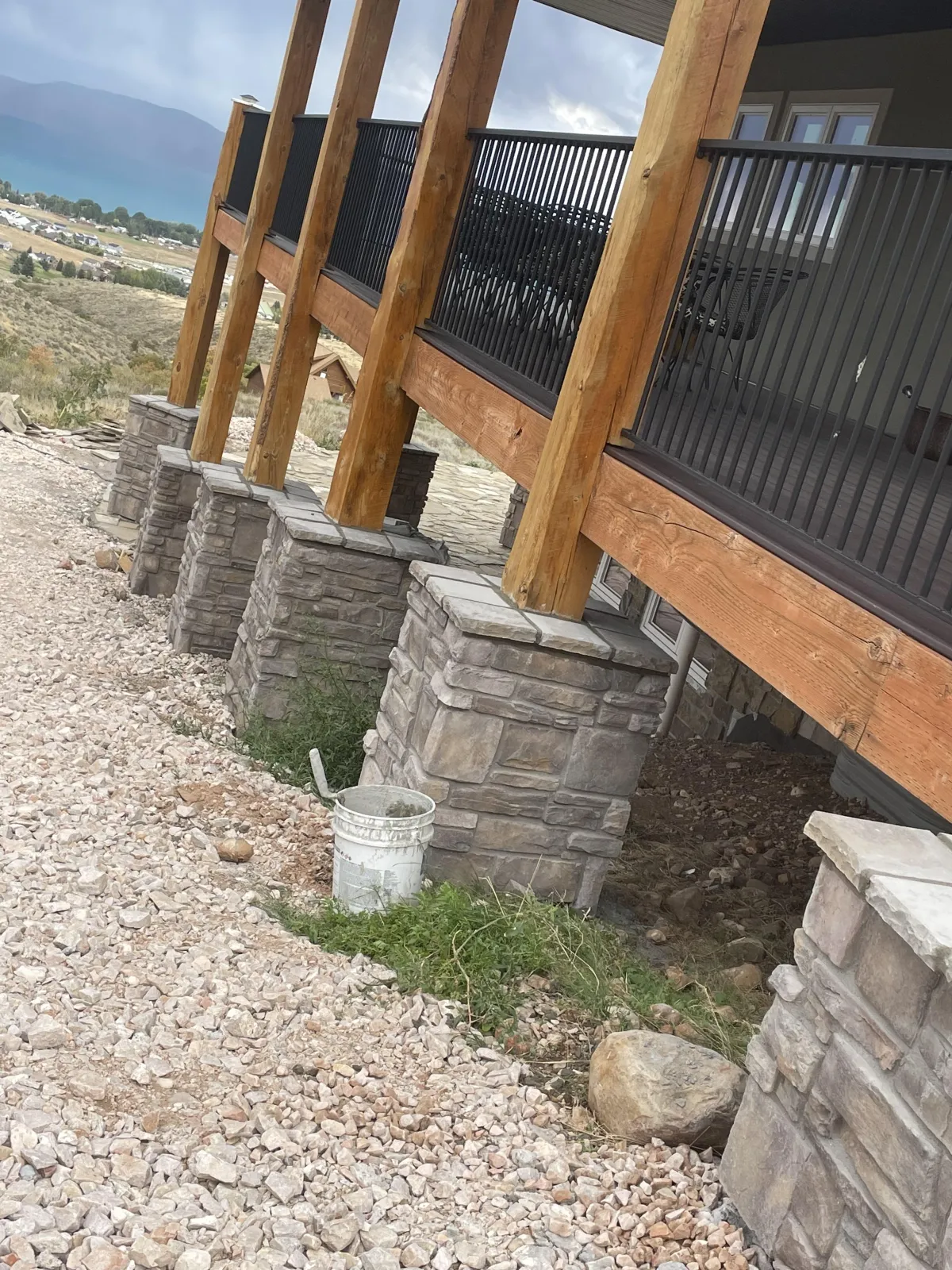 Beautiful residential home with stone and brick exterior built by AMG Construction & Landscaping in Kearns, Utah